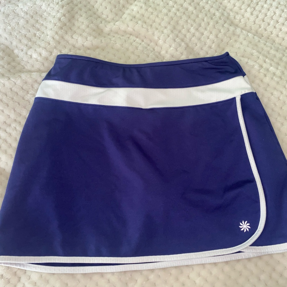 Worn but almost new athleta Tenis Skirt! Dark Purple size Small